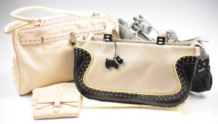 Three large Radley handbags and a purse, includes one with pink stitching and padlock clasp, all
