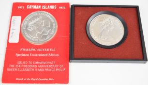 Two Cayman Islands $25 silver coins, one proof, one uncirculated