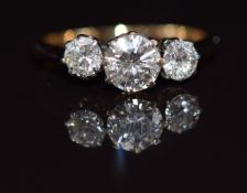 An 18ct gold ring set with three diamonds of approximately 0.5ct, 0.2ct and 0.2ct, 1.9g, size J