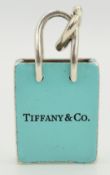 Tiffany & Co silver charm in the form of a shopping bag set with aqua enamel