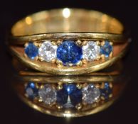 An 18ct gold ring set with three sapphires and diamonds, Edinburgh 1979, 5.1g, size J