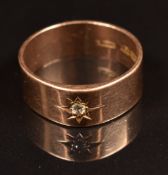 A 9ct rose gold ring set with a diamond in a star setting, Birmingham 1914, 5.6g, size S/T