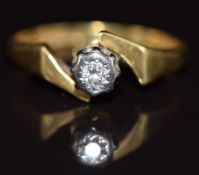 An 18ct gold ring set with a diamond in an illusion setting, 2.6g, size J