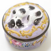 19thC Bilston or similar enamel circular hinged box decorated with a recumbent spaniel in relief,