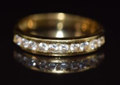 An 18ct gold half eternity ring set with ten round cut diamonds, 4.3g, size P