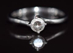 A platinum ring set with a round brilliant cut diamond of approximately 0.34ct, 3.1g, size L