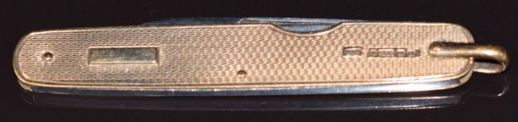 A 9ct gold engine turned knife, Birmingham 1936