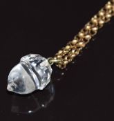 A c1900 9ct gold guard chain with engine turned barrel clasp and a glass pendant in the form of an