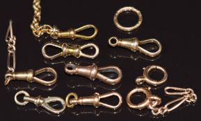 Two 18ct gold clips (3.3g), a 15ct gold clip (1.6g), four 9ct gold clips, two 9ct gold clasps, and a