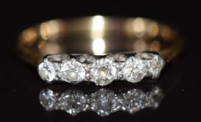 An 18ct gold set with five diamonds, 2.2g, size O