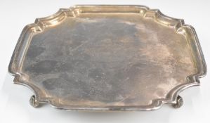 Mappin & Webb Art Deco hallmarked silver salver with incuse corners, raised on four scroll feet,