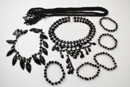 Two Victorian French jet necklaces, an Art Deco French jet necklace and five carved jet bracelets