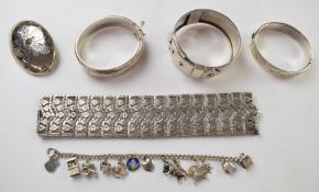 Victorian silver bangle with applied gold decoration and other silver jewellery including buckle