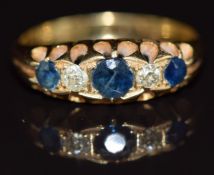 An 18ct gold ring set with three sapphires and diamonds, Birmingham 1913, 3.6g, size N