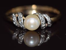 A 9ct gold ring set with a cultured pearl and diamonds, 1.9g, size V