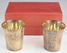 Cased pair of Elizabeth II feature hallmarked silver beakers or tumblers, Birmingham 1973, maker