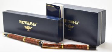 Waterman Red Ripple Rhapsody fountain and ballpoint pen set both with gold plated fittings, in