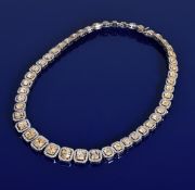A fancy diamond set necklace or collarette set with forty eight cushion cut yellow diamonds, the