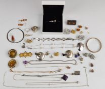 A collection of silver jewellery including bangles, chains, bracelet, two rings, earrings,