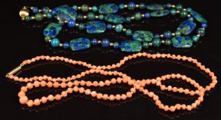 A c1920 necklace of coral beads with 15ct gold engraved barrel clasp and a necklace of malachite and