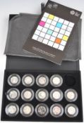 Fourteen Royal Mint coins from the London 2012 Silver 50p Sports Collection, with booklet in