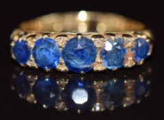 An 18ct gold ring set with five sapphires and rose cut diamonds, Birmingham 1903, 4g, size L