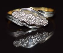 An 18ct gold ring set with three diamonds in a platinum twist setting, 2.8g, size K