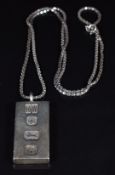 A silver ingot on silver chain