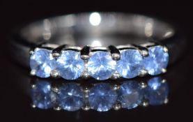 A 9ct white gold ring set with five round cut sapphires, 2.8g, size N