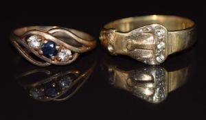 A 9ct gold buckle ring set with cubic zirconia and a 9ct gold ring set with a sapphire and cubic