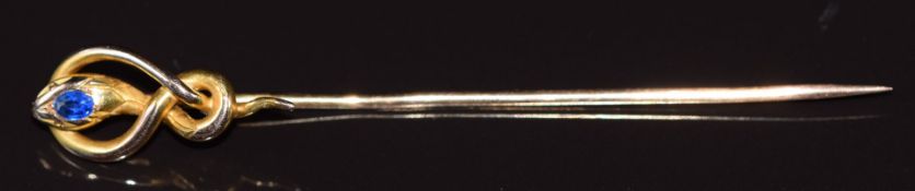 An 18ct gold stick pin in the form of a snake set with a paste, 3.4g 7.2x1cm