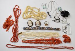 A collection of jewellery including jet mourning brooch, mother of pearl necklace, two cameo