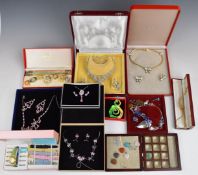 A collection of boxed costume jewellery including suites of paste set, enamelled, set of twelve