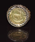 A 9ct gold ring set with a 1984 1/10 krugerrand, 6.4g, size O