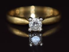 An 18ct gold ring set with a round cut diamond of approximately 0.3ct, 2.8g, size K
