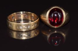 A 9ct gold ring set with a synthetic ruby cabochon and a 9ct gold eternity ring, 5g, size J & G