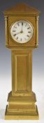 A 19thC or early 20thC brass miniature novelty longcase clock, with key wound movement stamped E G