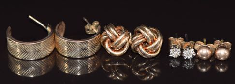 Four pairs of 9ct gold earrings, one pair set with a diamond, 5g