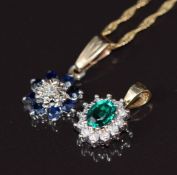 A 9ct gold pendant set with a diamond surrounded by sapphires, a 9ct gold pendant set with quartz