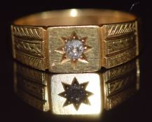 An 18ct gold ring set with a diamond in a star setting, Chester 1929, 8.3g, size W