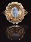 A 9ct gold ring set with an oval cut smoky quartz, 3g, size L