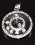 An 18ct white gold pendant set with diamonds with locket compartment containing further diamonds,