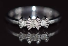 A 9ct white gold ring set with three diamonds, 2g, size N