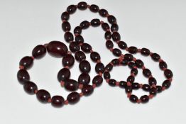 A cherry amber necklace made up of 65 oval beads, 45g