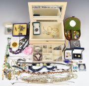A collection of costume jewellery including silver brooch in the form of a lily set with enamel