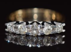 An 18ct gold ring set with five diamonds, the centre diamond approximately 0.21ct, 5.0g, size P