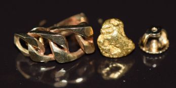 A single gold nugget earring (1g), a 9ct gold earring (1.3g) and a 14k gold earring back (0.15g)