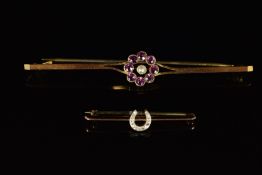 A 9ct gold brooch in the form of a horseshoe set with diamonds and a 9ct gold brooch set with