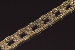 A 9ct gold bracelet made up of pierced links set with a diamond, 30.4g 19.5cm