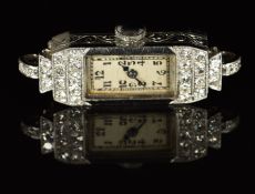 Art Deco diamond set platinum ladies wristwatch with blued hands, black Arabic numerals, silver